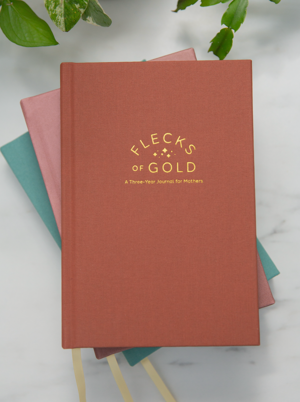 Terracotta Linen Flecks of Gold Journal with gold embossing. A Three-Year Journal For Mothers. Helping you find the joy in Motherhood. A journal for moms who want to see the good in every day. Helping overwhelmed, busy moms. Created by Rachel Nielson of 3 in 30 Podcast. Gratitude Journal.  Motherhood Journal.