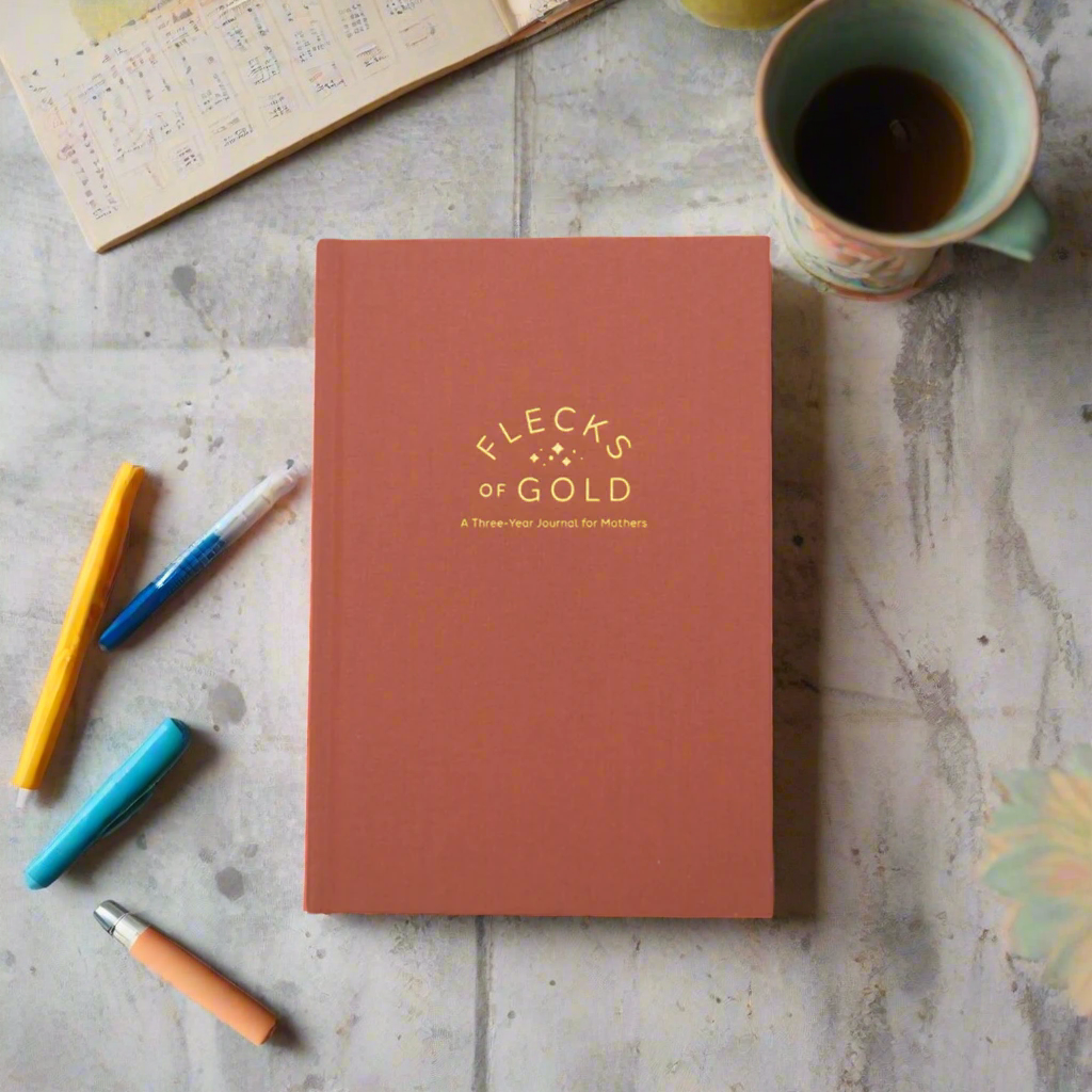Teracotta Linen Flecks of Gold Journal with gold embossing. A Three-Year Journal For Mothers. Helping you find the joy in Motherhood. A journal for moms who want to see the good in every day. Helping overwhelmed, busy moms. Created by Rachel Nielson of 3 in 30 Podcast. Motherhood Journal.  Gratitude Journal.