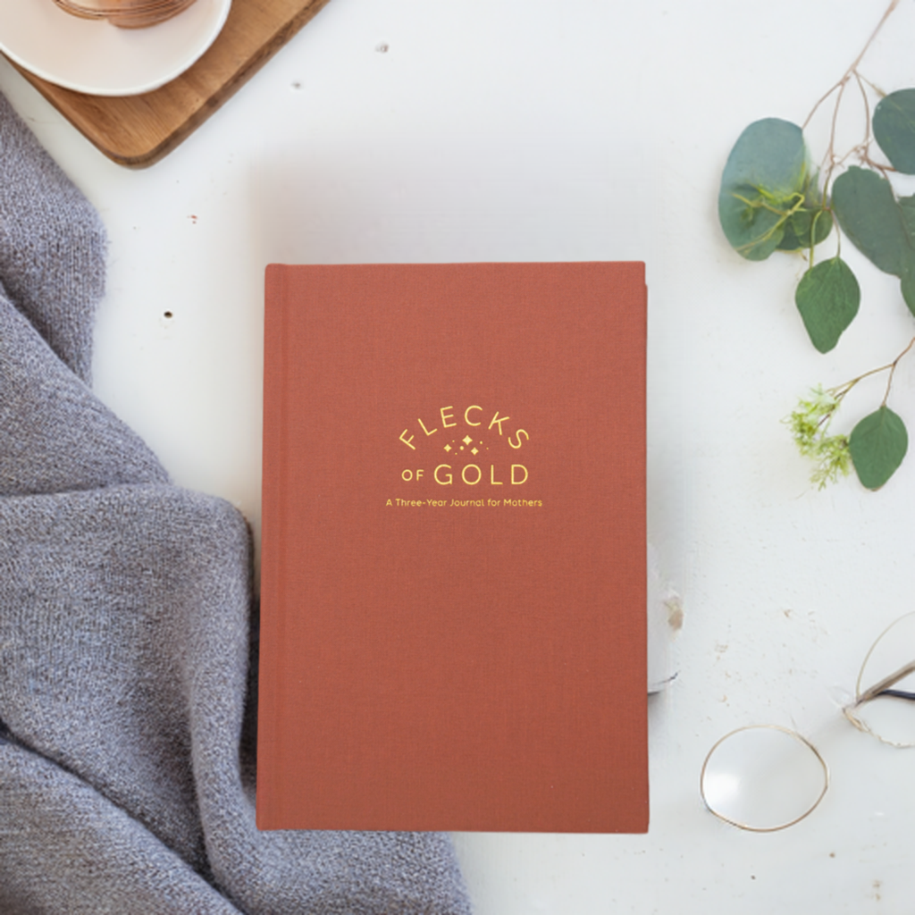 Teracotta Linen Flecks of Gold Journal with gold embossing. A Three-Year Journal For Mothers. Helping you find the joy in Motherhood. A journal for moms who want to see the good in every day. Helping overwhelmed, busy moms. Created by Rachel Nielson of 3 in 30 Podcast. Motherhood Journal.  Gratitude Journal.