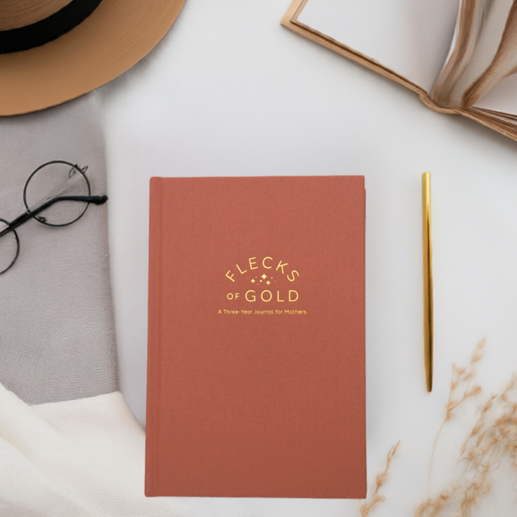 Teracotta Linen Flecks of Gold Journal with gold embossing. A Three-Year Journal For Mothers. Helping you find the joy in Motherhood. A journal for moms who want to see the good in every day. Helping overwhelmed, busy moms. Created by Rachel Nielson of 3 in 30 Podcast. Motherhood Journal.  Gratitude Journal.