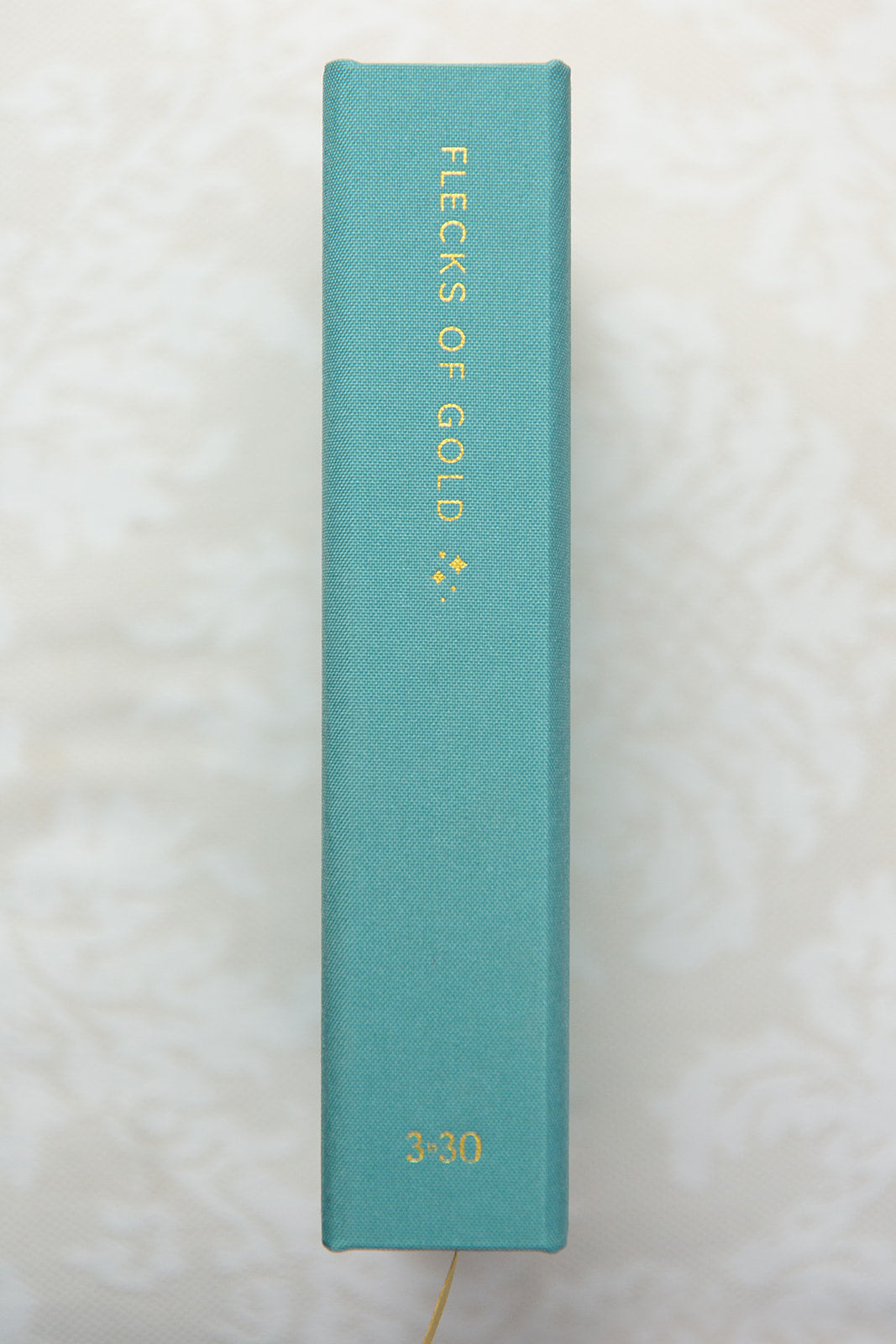 Teal Linen Flecks of Gold Journal with gold embossing. A Three-Year Journal For Mothers. Helping you find the joy in Motherhood. A journal for moms who want to see the good in every day. Helping overwhelmed, busy moms. Created by Rachel Nielson of 3 in 30 Podcast. Motherhood Journal.  Gratitude Journal.