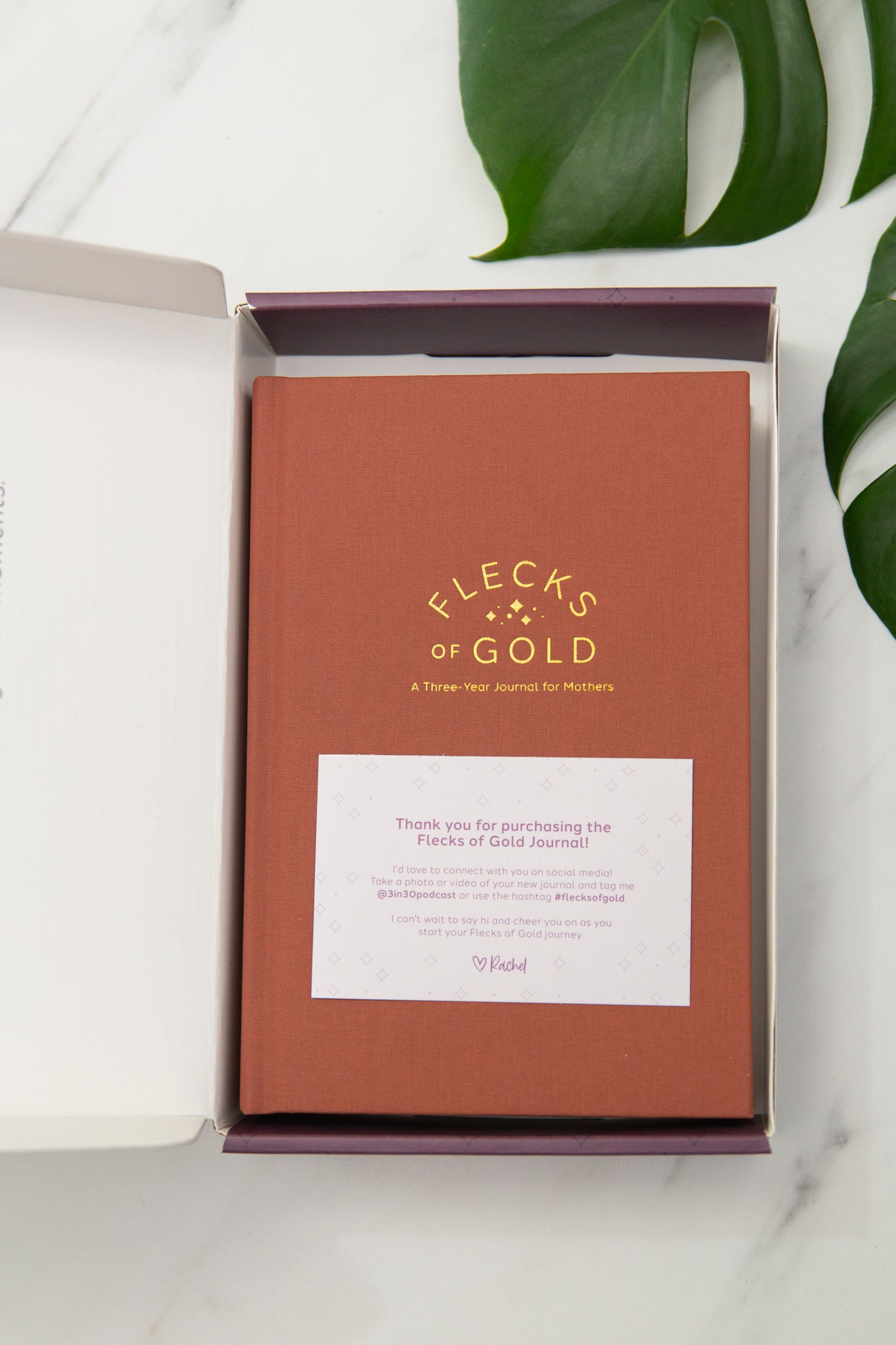 Terracotta Linen Flecks of Gold Journal with gold embossing. A Three-Year Journal For Mothers. Helping you find the joy in Motherhood. A journal for moms who want to see the good in every day. Helping overwhelmed, busy moms. Created by Rachel Nielson of 3 in 30 Podcast.