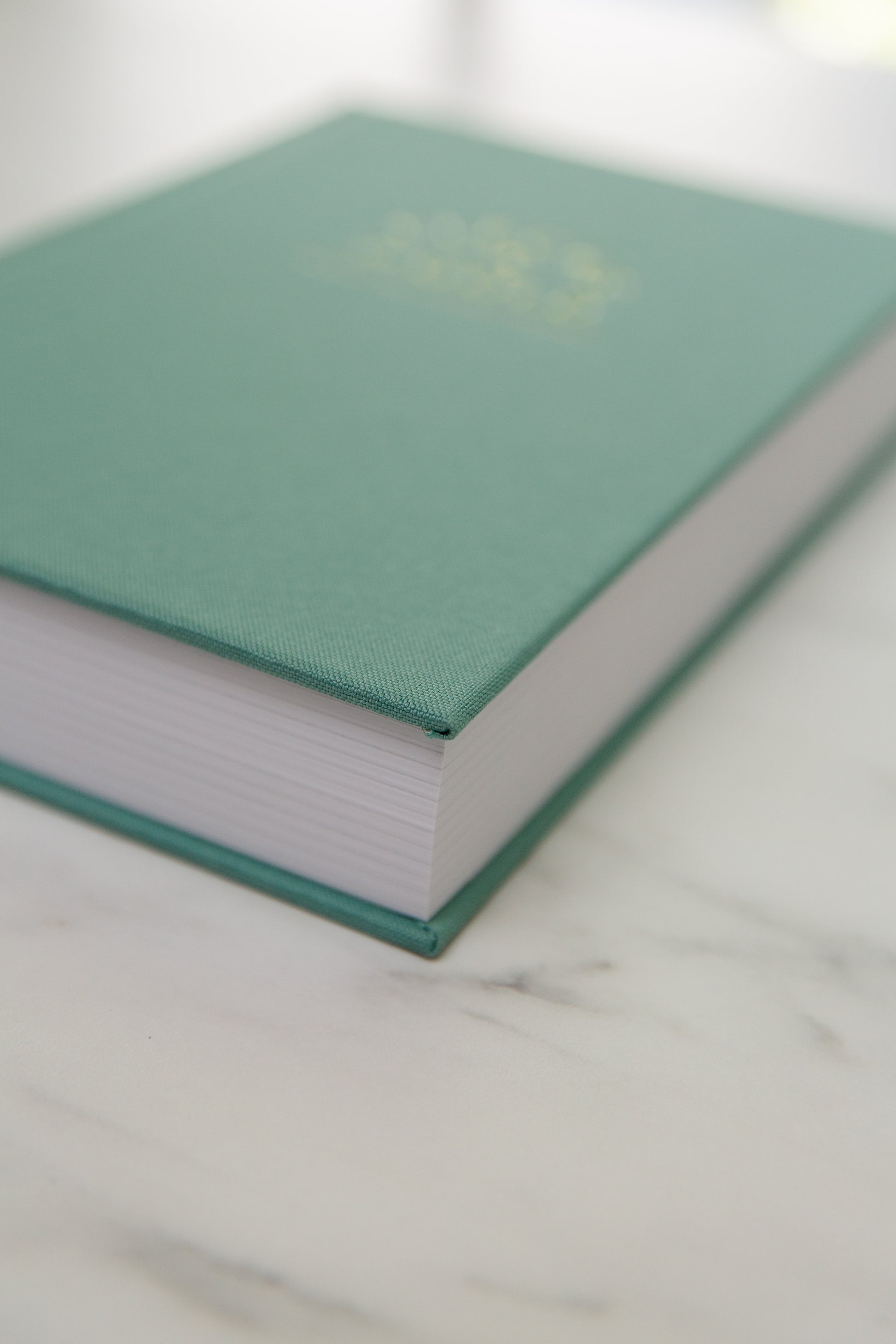 Teal Linen Flecks of Gold Journal with gold embossing. A Three-Year Journal For Mothers. Helping you find the joy in Motherhood. A journal for moms who want to see the good in every day. Helping overwhelmed, busy moms. Created by Rachel Nielson of 3 in 30 Podcast. Motherhood Journal.  Gratitude Journal.