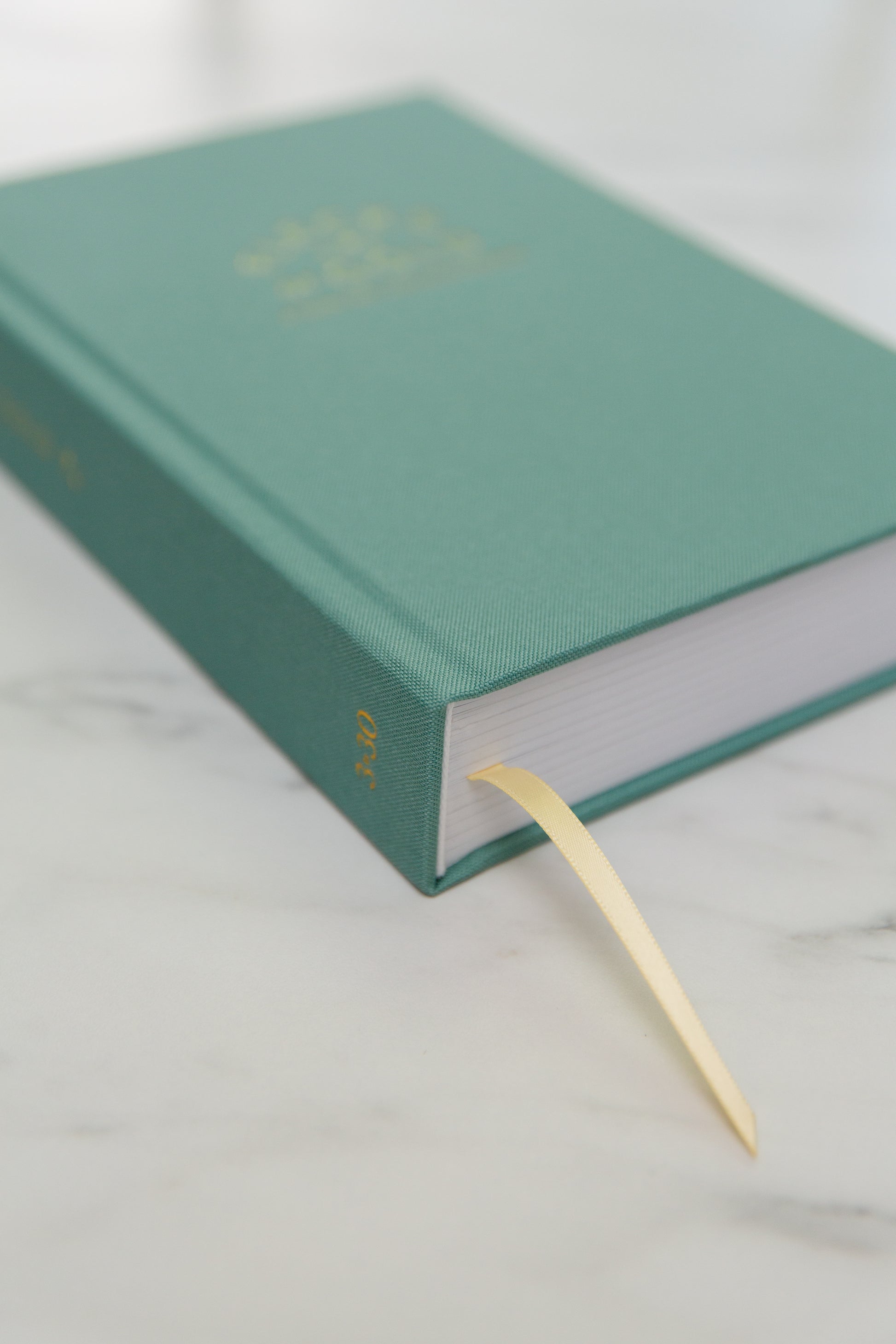 Teal Linen Flecks of Gold Journal with gold embossing. A Three-Year Journal For Mothers. Helping you find the joy in Motherhood. A journal for moms who want to see the good in every day. Helping overwhelmed, busy moms. Created by Rachel Nielson of 3 in 30 Podcast.  Motherhood Journal.  Three-year journal. Gratitude Journal.