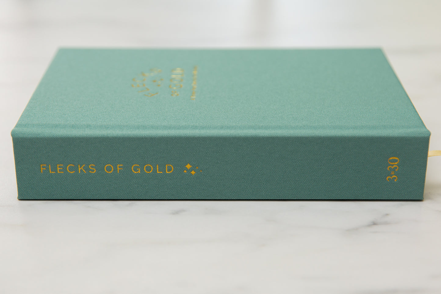 Teal Linen Flecks of Gold Journal with gold embossing. A Three-Year Journal For Mothers. Helping you find the joy in Motherhood. A journal for moms who want to see the good in every day. Helping overwhelmed, busy moms. Created by Rachel Nielson of 3 in 30 Podcast. Motherhood Journal.  Gratitude Journal.