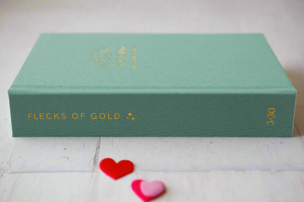 Teal Linen Flecks of Gold Journal with gold embossing. A Three-Year Journal For Mothers. Helping you find the joy in Motherhood. A journal for moms who want to see the good in every day. Helping overwhelmed, busy moms. Created by Rachel Nielson of 3 in 30 Podcast.  Motherhood Journal.  Three-year journal. Gratitude Journal.