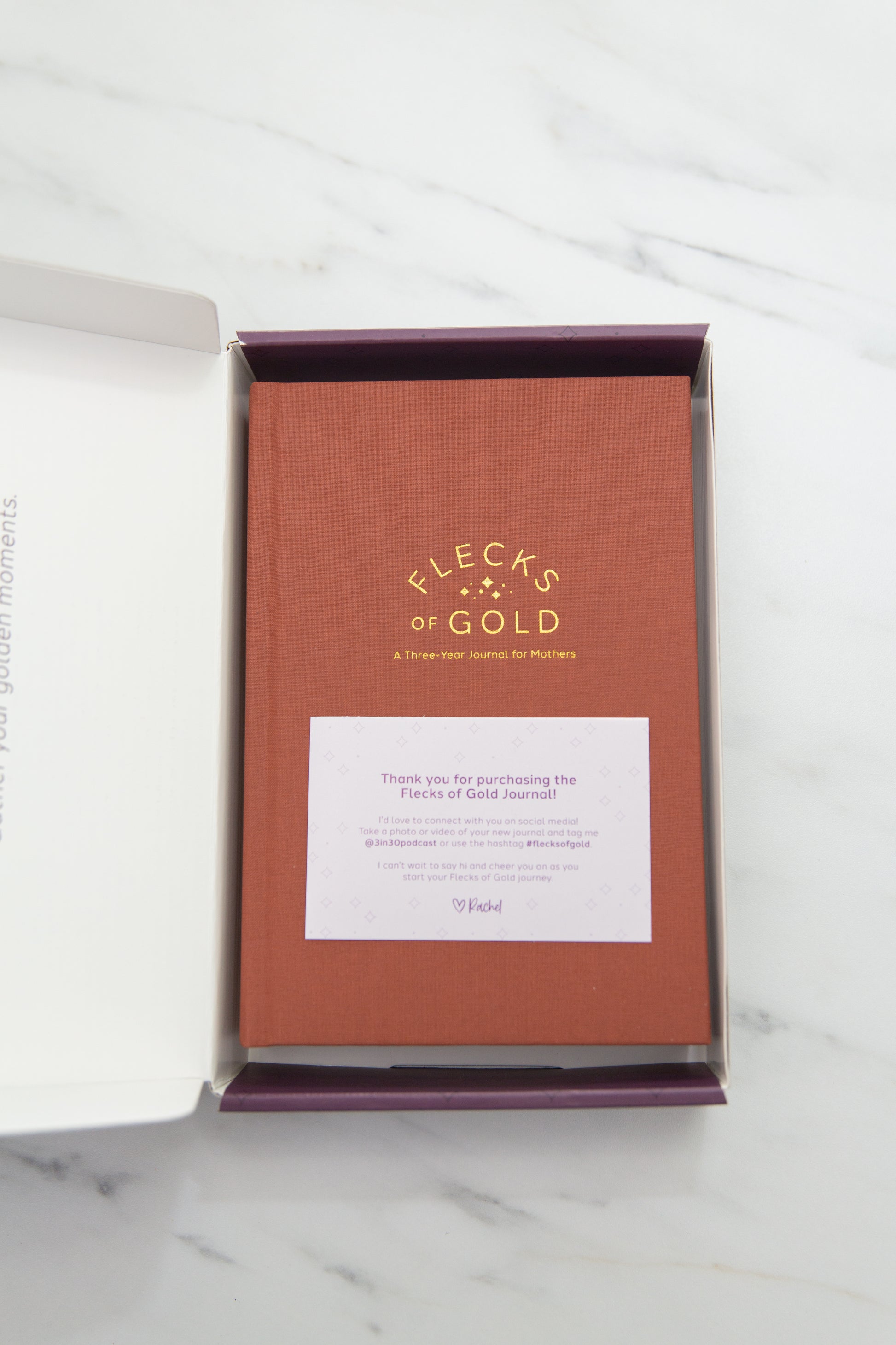 Terracotta Linen Flecks of Gold Journal with gold embossing. A Three-Year Journal For Mothers. Helping you find the joy in Motherhood. A journal for moms who want to see the good in every day. Helping overwhelmed, busy moms. Created by Rachel Nielson of 3 in 30 Podcast.