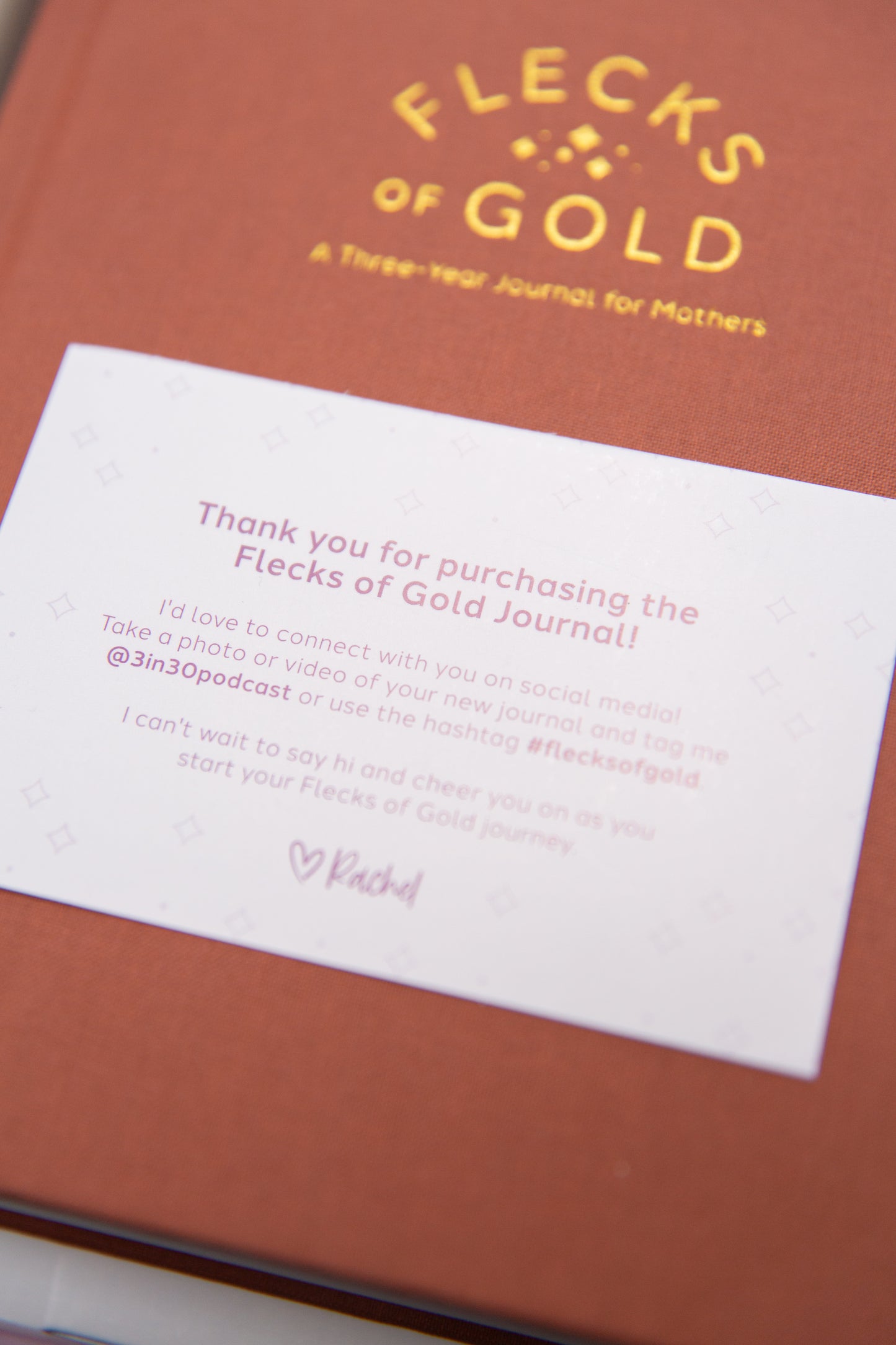 Terracotta Linen Flecks of Gold Journal with gold embossing. A Three-Year Journal For Mothers. Helping you find the joy in Motherhood. A journal for moms who want to see the good in every day. Helping overwhelmed, busy moms. Created by Rachel Nielson of 3 in 30 Podcast.