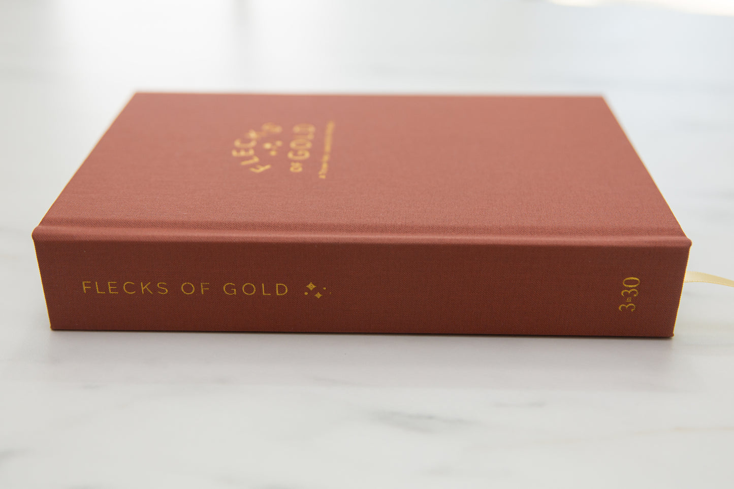 Terracotta Linen Flecks of Gold Journal with gold embossing. A Three-Year Journal For Mothers. Helping you find the joy in Motherhood. A journal for moms who want to see the good in every day. Helping overwhelmed, busy moms. Created by Rachel Nielson of 3 in 30 Podcast.