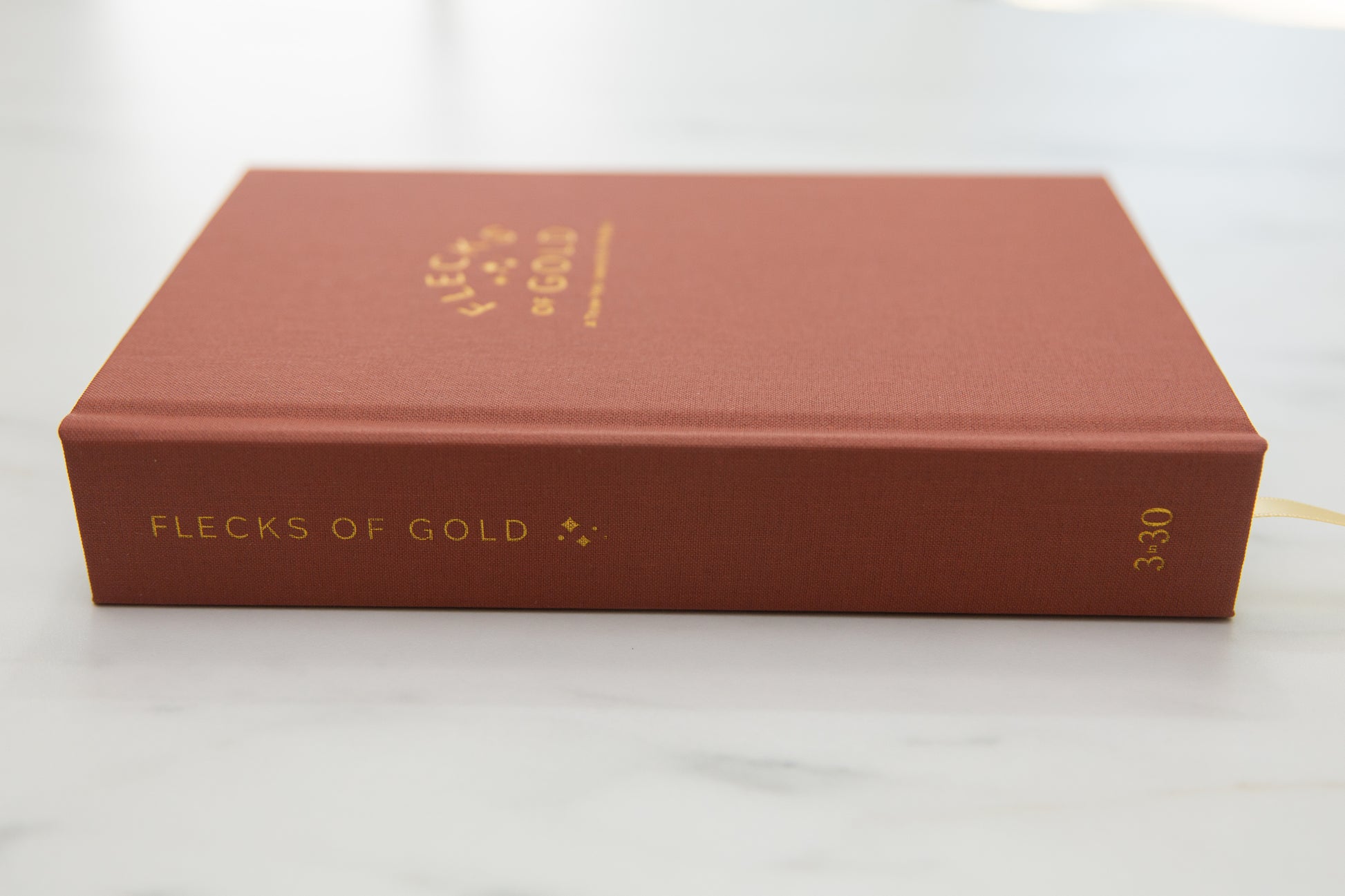 Terracotta Linen Flecks of Gold Journal with gold embossing. A Three-Year Journal For Mothers. Helping you find the joy in Motherhood. A journal for moms who want to see the good in every day. Helping overwhelmed, busy moms. Created by Rachel Nielson of 3 in 30 Podcast.