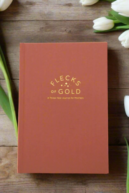 Teracotta Linen Flecks of Gold Journal with gold embossing. Love Your Motherhood.  A Three-Year Journal For Mothers. Helping you find the joy in Motherhood. A journal for moms who want to see the good in every day. Helping overwhelmed, busy moms. Created by Rachel Nielson of 3 in 30 Podcast.  Motherhood Journal.  Three-year journal. Gratitude Journal.