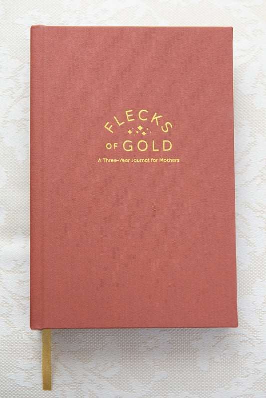 Terracotta Linen Flecks of Gold Journal with gold embossing. A Three-Year Journal For Mothers. Helping you find the joy in Motherhood. A journal for moms who want to see the good in every day. Helping overwhelmed, busy moms. Created by Rachel Nielson of 3 in 30 Podcast.
