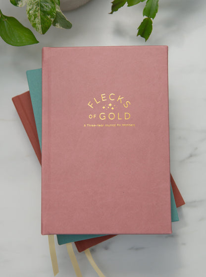 Rose Vegan Leather Flecks of Gold Journal with gold embossing. A Three-Year Journal For Mothers. Helping you find the joy in Motherhood. A journal for moms who want to see the good in every day. Helping overwhelmed, busy moms. Created by Rachel Nielson of 3 in 30 Podcast.  Wipeable cover.